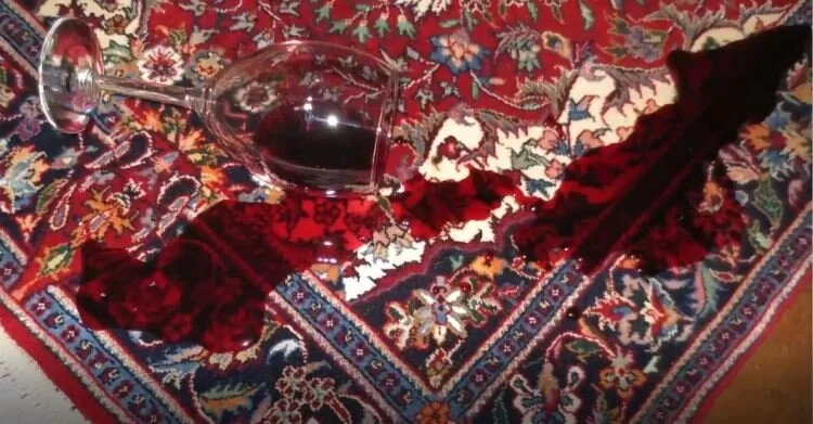 How do I clean a spilled glass of wine on a silk rug without permanently destroying the fiber’s sheen?